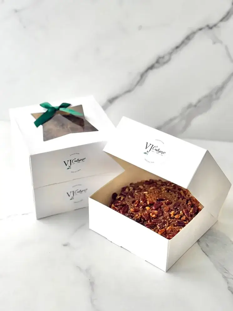 White gift boxes with green ribbon on marble